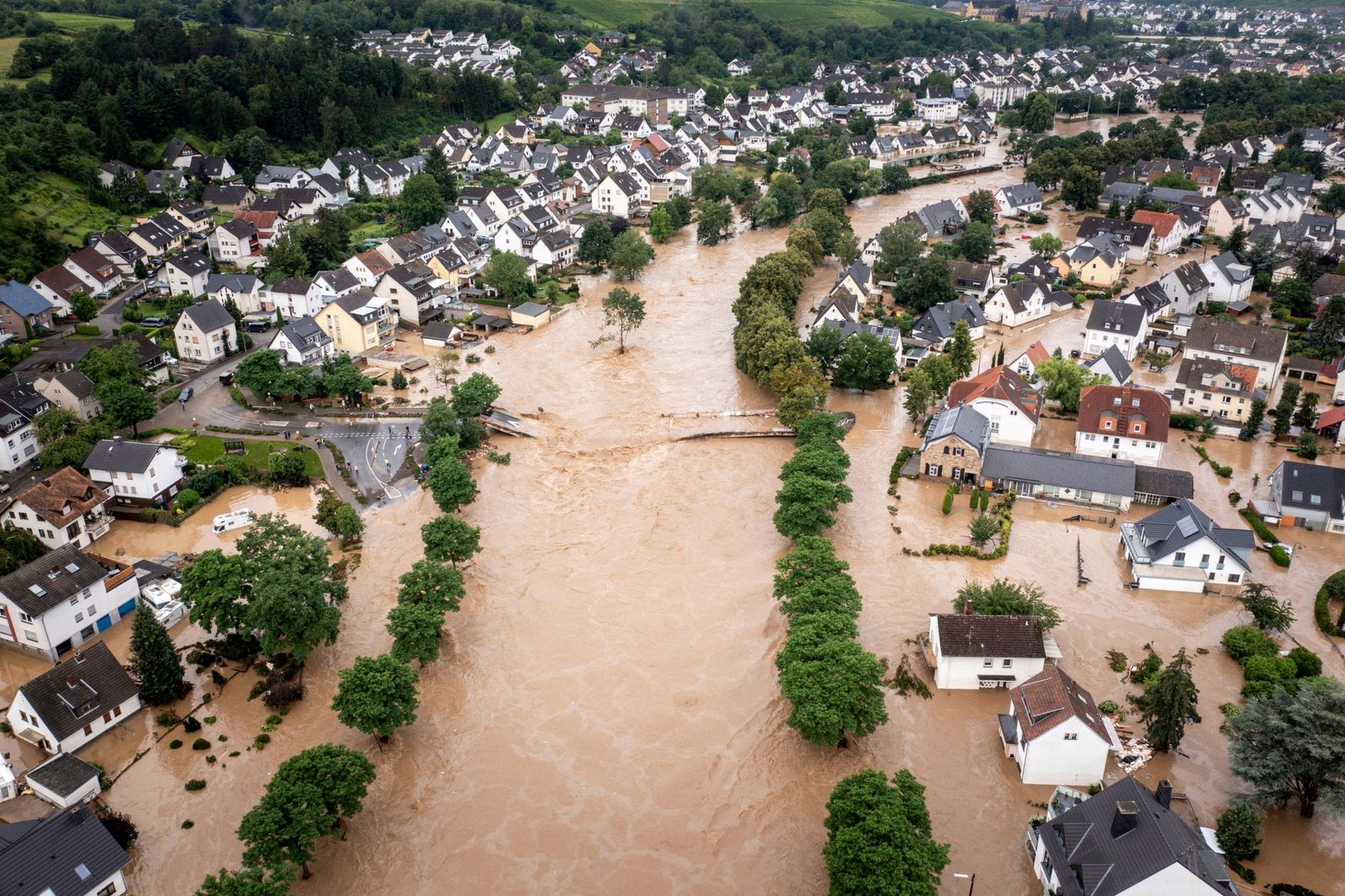 Aerial view of floodwater moving through a residential community